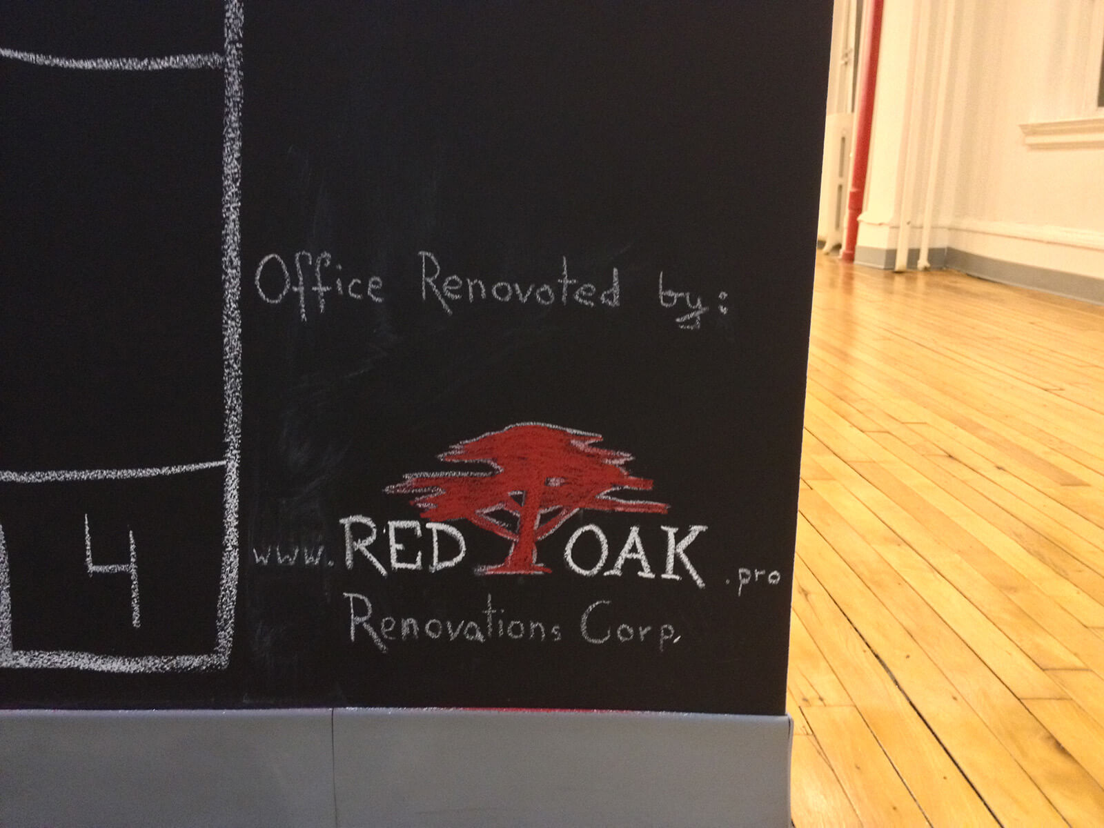 Red oak logo on a chalk board