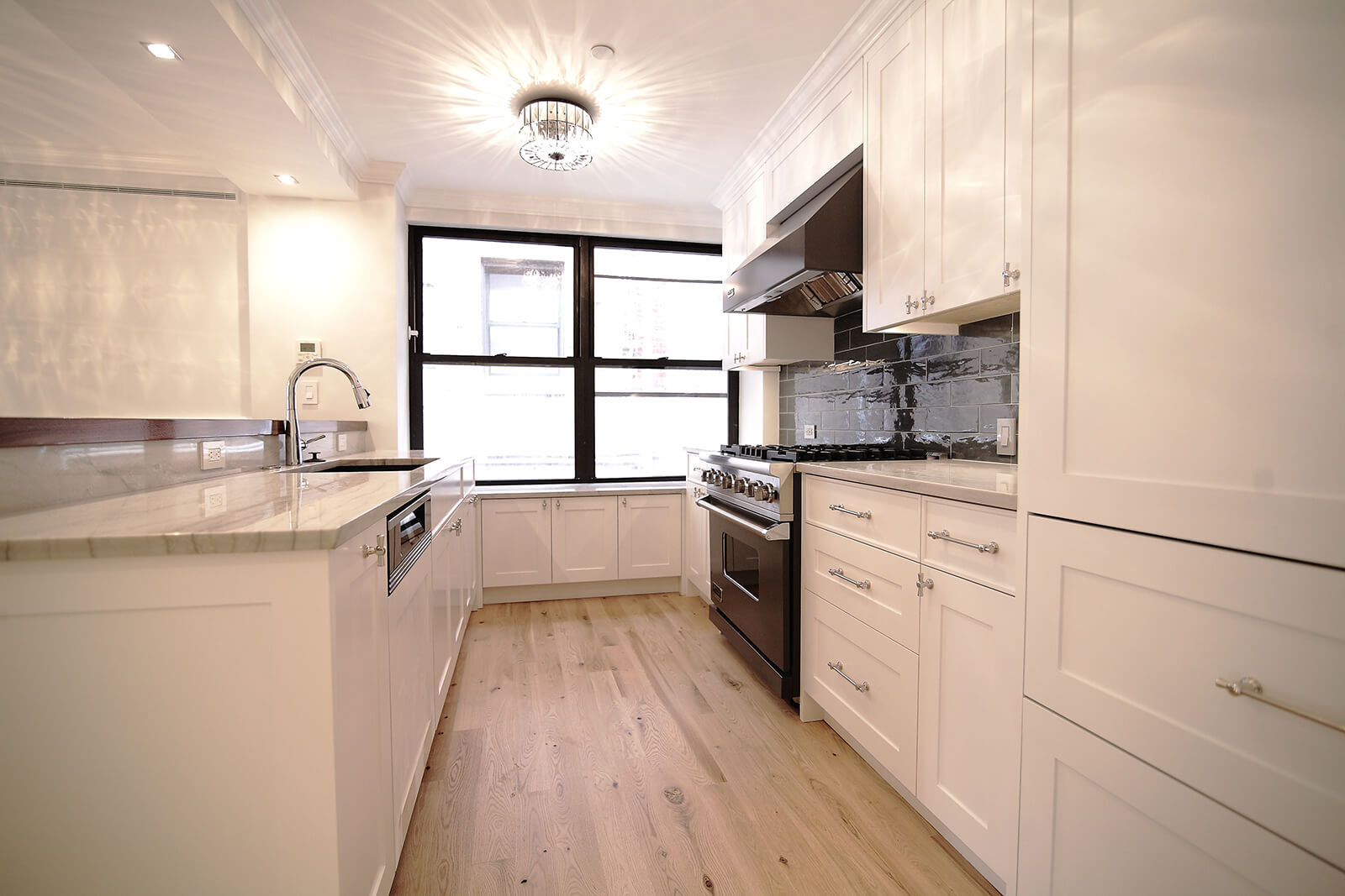 Renovated white apartment kitchen